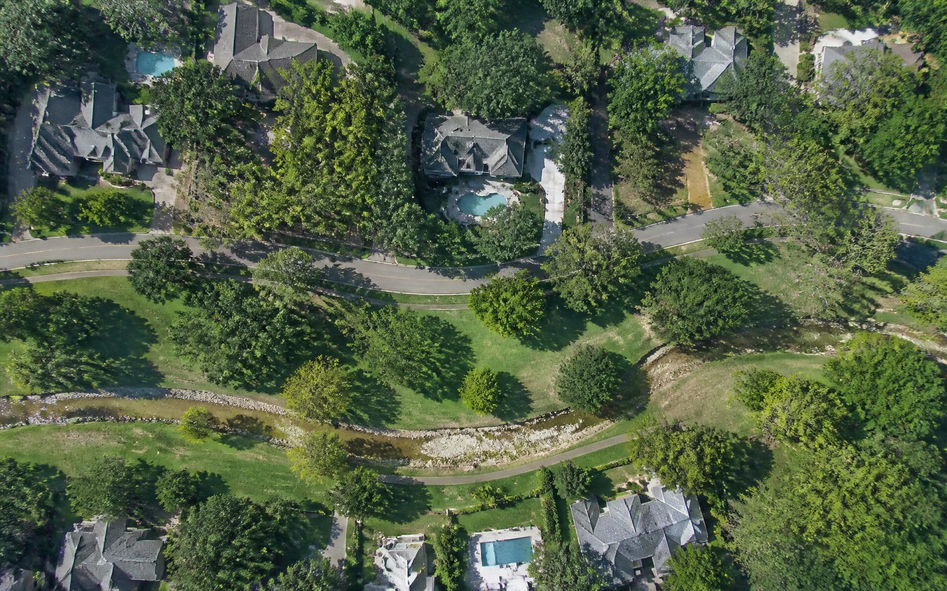 Overhead aerial map view of Myers Park streets, homes, and the creek corridor